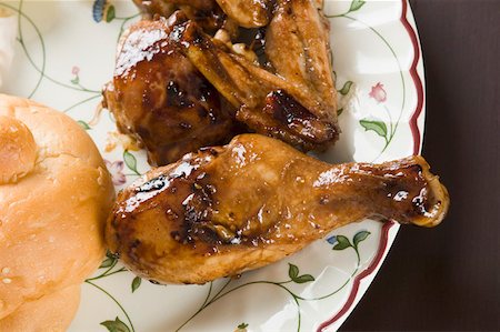 Close-up of roast chickens in a plate Stock Photo - Premium Royalty-Free, Code: 630-01875991