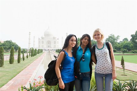 simsearch:630-01872552,k - Portrait of three young women standing together and smiling, Taj Mahal, Agra, Uttar Pradesh, India Stock Photo - Premium Royalty-Free, Code: 630-01876256