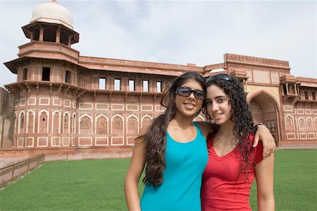 simsearch:630-01872552,k - Portrait of two young women standing together and smiling, Taj Mahal, Agra, Uttar Pradesh, India Stock Photo - Premium Royalty-Free, Code: 630-01876312