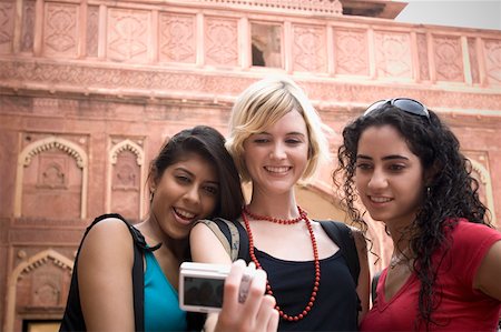 simsearch:630-01872552,k - Close-up of three young women taking a picture of themselves, Taj Mahal, Agra, Uttar Pradesh, India Stock Photo - Premium Royalty-Free, Code: 630-01876328