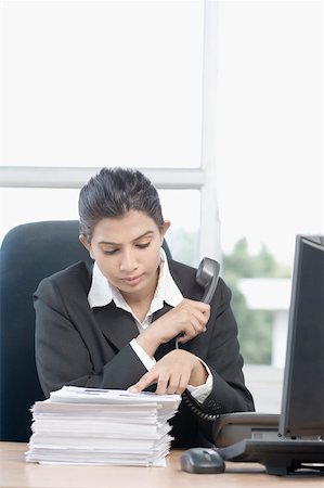 phone cord - Close-up of a businesswoman holding a telephone receiver Stock Photo - Premium Royalty-Free, Code: 630-01876375