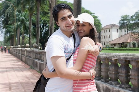 simsearch:630-01876693,k - Portrait of a young couple embracing each other and smiling, Goa, India Stock Photo - Premium Royalty-Free, Code: 630-01876649