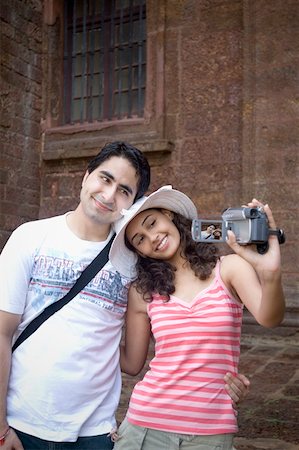 simsearch:630-01876693,k - Young couple making a film of themselves with a home video camera, Goa, India Stock Photo - Premium Royalty-Free, Code: 630-01876689