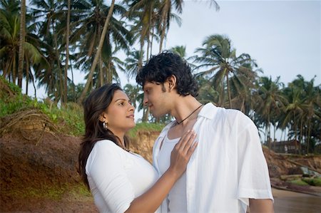 Young couple face to face on the beach, Goa, India Stock Photo - Premium Royalty-Free, Code: 630-01876721
