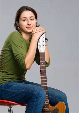 simsearch:640-01365707,k - Portrait of a young woman holding a guitar Stock Photo - Premium Royalty-Free, Code: 630-01877108