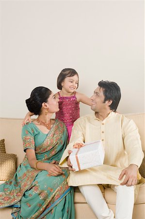 Girl smiling with her parents Stock Photo - Premium Royalty-Free, Code: 630-01877193