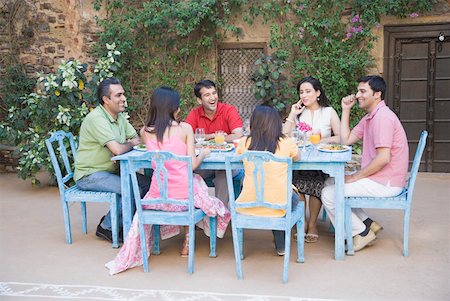 Group of people sitting at a dining table Stock Photo - Premium Royalty-Free, Code: 630-01872833