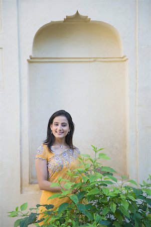 Portrait of a mid adult woman smiling Stock Photo - Premium Royalty-Free, Code: 630-01872911