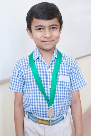 simsearch:630-01873514,k - Portrait of a school boy with a medal around his neck Foto de stock - Sin royalties Premium, Código: 630-01873521