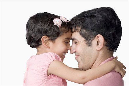 Close-up of a mid adult man and his daughter rubbing their noses Stock Photo - Premium Royalty-Free, Code: 630-02219219