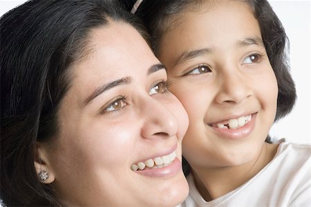 simsearch:630-02219943,k - Close-up of a girl smiling  with her mother Stock Photo - Premium Royalty-Free, Code: 630-02219344