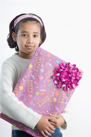 simsearch:630-02221120,k - Portrait of a girl holding a present Stock Photo - Premium Royalty-Free, Code: 630-02219367