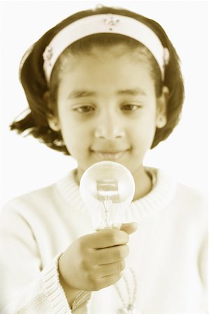 simsearch:630-02221120,k - Girl holding a light bulb Stock Photo - Premium Royalty-Free, Code: 630-02219374