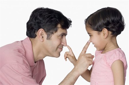 simsearch:630-02219943,k - Close-up of a mid adult man and his daughter touching their noses Stock Photo - Premium Royalty-Free, Code: 630-02219396