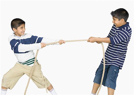 Two boys playing tug-of-war Stock Photo - Premium Royalty-Free, Code: 630-02219405