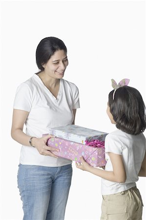 simsearch:630-02219943,k - Mid adult woman giving gifts to her daughter Stock Photo - Premium Royalty-Free, Code: 630-02219548