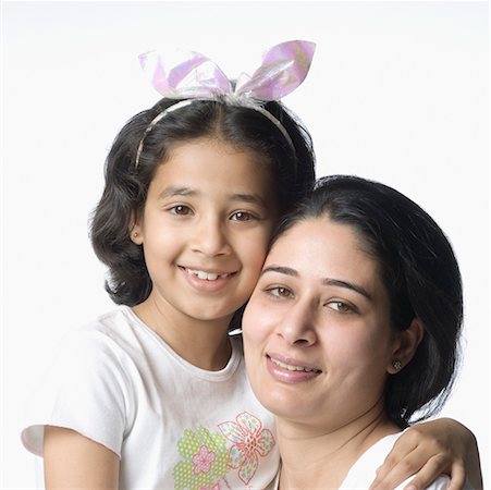 simsearch:630-02219943,k - Close-up of a girl hugging her mother and smiling Stock Photo - Premium Royalty-Free, Code: 630-02219541