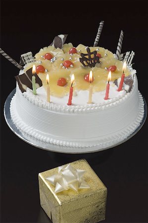 simsearch:630-02219911,k - Close-up of lit candles on a birthday cake Stock Photo - Premium Royalty-Free, Code: 630-02219705