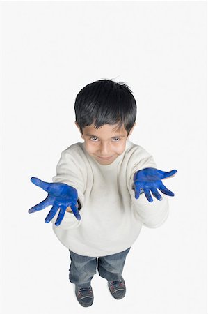 High angle view of a boy showing his painted palms Stock Photo - Premium Royalty-Free, Code: 630-02219769