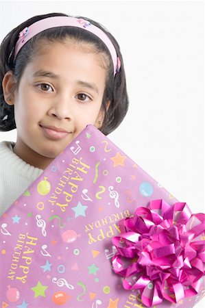 simsearch:630-02221120,k - Portrait of a girl holding a present Stock Photo - Premium Royalty-Free, Code: 630-02219760