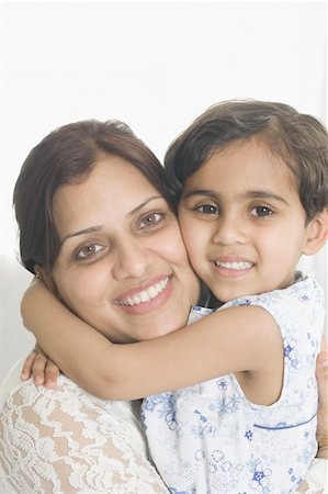 simsearch:630-02219943,k - Portrait of a girl hugging her mother and smiling Stock Photo - Premium Royalty-Free, Code: 630-02219793