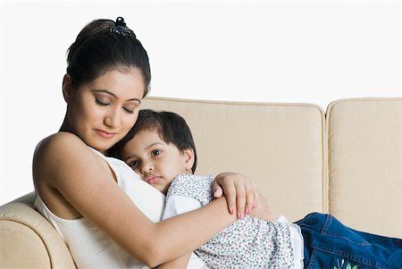 simsearch:630-02219943,k - Young woman with her daughter resting on a couch Stock Photo - Premium Royalty-Free, Code: 630-02219867