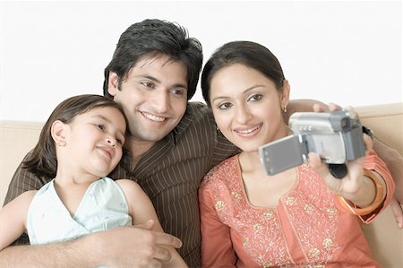 simsearch:630-01296751,k - Close-up of a couple with their daughter filming themselves Stock Photo - Premium Royalty-Free, Code: 630-02219948