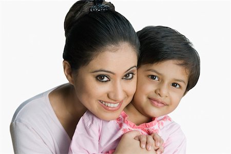simsearch:630-02219943,k - Close-up of a young woman smiling with her daughter Stock Photo - Premium Royalty-Free, Code: 630-02220054
