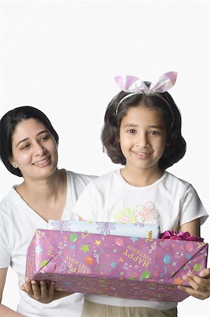 simsearch:630-02219943,k - Portrait of a girl holding a gift Stock Photo - Premium Royalty-Free, Code: 630-02220334