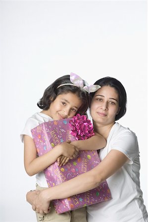 simsearch:630-02219943,k - Portrait of a girl holding a gift Stock Photo - Premium Royalty-Free, Code: 630-02220332