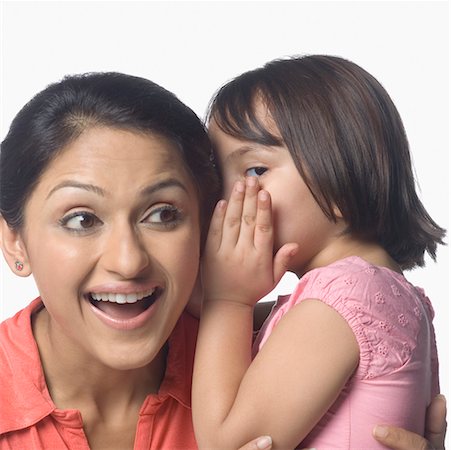 pictures of a little girl whispering - Girl whispering into her mother's ear Stock Photo - Premium Royalty-Free, Code: 630-02220540