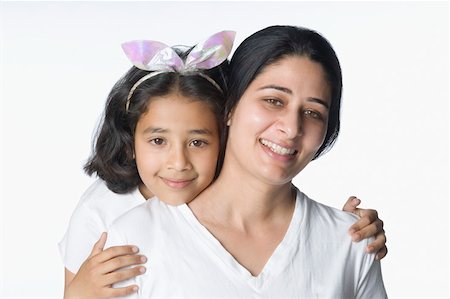simsearch:630-02219943,k - Portrait of a girl smiling with her mother Stock Photo - Premium Royalty-Free, Code: 630-02220710