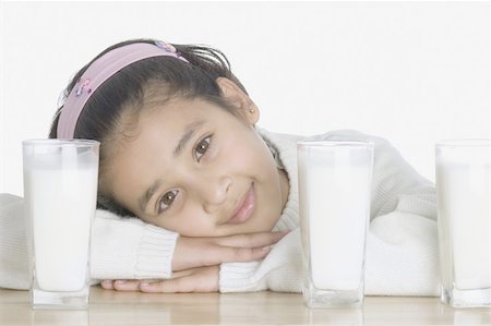simsearch:630-02221120,k - Portrait of a girl with glasses of milk on a table Stock Photo - Premium Royalty-Free, Code: 630-02220742
