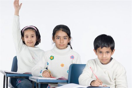 simsearch:630-02221120,k - Three students sitting in a classroom Stock Photo - Premium Royalty-Free, Code: 630-02220743