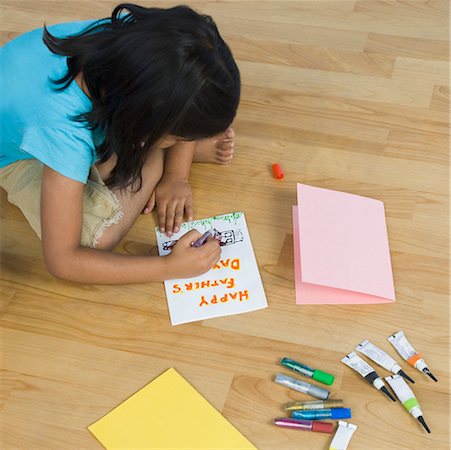 simsearch:630-02221120,k - High angle view of a girl making a greeting card Stock Photo - Premium Royalty-Free, Code: 630-02220985