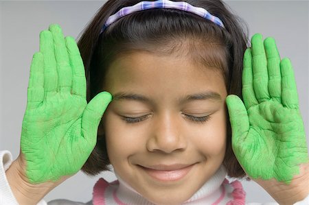 simsearch:630-02221120,k - Close-up of a girl showing her painted palms Stock Photo - Premium Royalty-Free, Code: 630-02221121