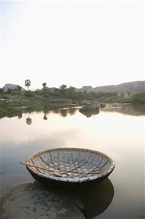 simsearch:630-03479347,k - Traditional basket boat in a river, Hampi, Karnataka, India Stock Photo - Premium Royalty-Free, Code: 630-03479174