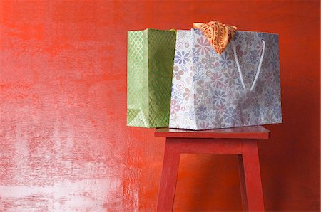 shopping bags closeup - Close-up of shopping bags on a stool Stock Photo - Premium Royalty-Free, Code: 630-03479455