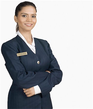 Portrait of an air hostess smiling Stock Photo - Premium Royalty-Free, Code: 630-03479531