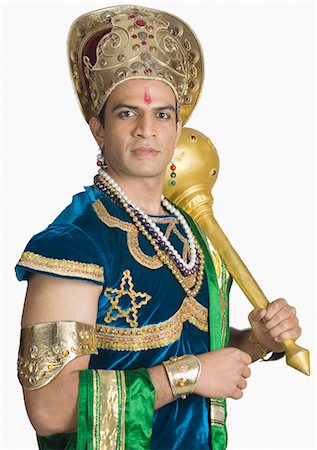 simsearch:630-03481389,k - Young man dressed-up as Bhima and holding a mace Foto de stock - Sin royalties Premium, Código: 630-03479572