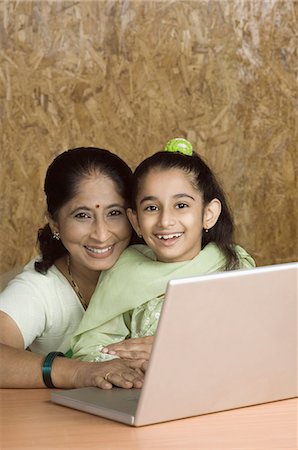 simsearch:630-03479683,k - Mature woman using a laptop with her granddaughter Stock Photo - Premium Royalty-Free, Code: 630-03479607