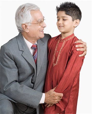 simsearch:630-03479740,k - Close-up of a senior man hugging his grandson Stock Photo - Premium Royalty-Free, Code: 630-03479643