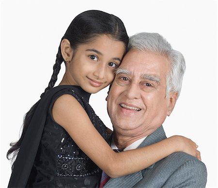 simsearch:630-03479740,k - Senior man carrying his granddaughter and smiling Stock Photo - Premium Royalty-Free, Code: 630-03479662