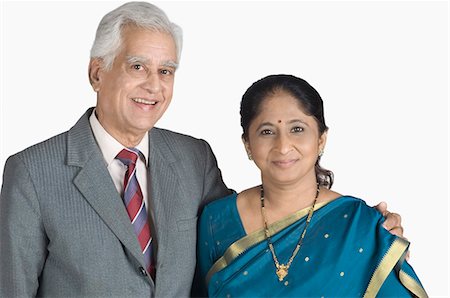 saree couples - Portrait of a senior man arm around a mature woman and smiling Stock Photo - Premium Royalty-Free, Code: 630-03479678
