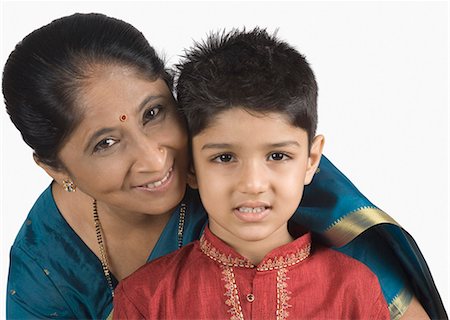simsearch:630-03479683,k - Portrait of a mature woman smiling with her grandson Stock Photo - Premium Royalty-Free, Code: 630-03479684