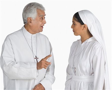 Priest talking to a nun Stock Photo - Premium Royalty-Free, Code: 630-03479687