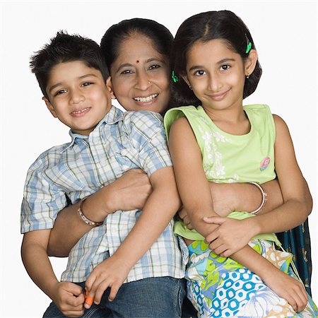 simsearch:630-03479683,k - Mature woman carrying her grandchildren and smiling Stock Photo - Premium Royalty-Free, Code: 630-03479764