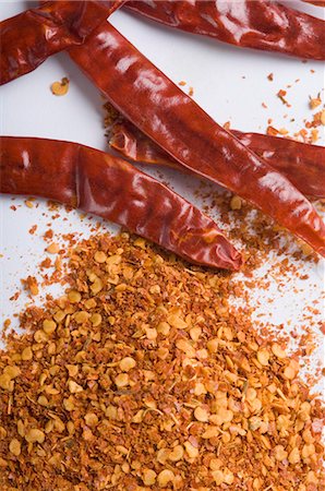 spicy - Close-up of red chili peppers with paprika Stock Photo - Premium Royalty-Free, Code: 630-03480040