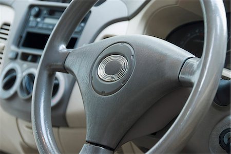 dashboard - Close-up of a car steering wheel, Delhi, India Stock Photo - Premium Royalty-Free, Code: 630-03480179