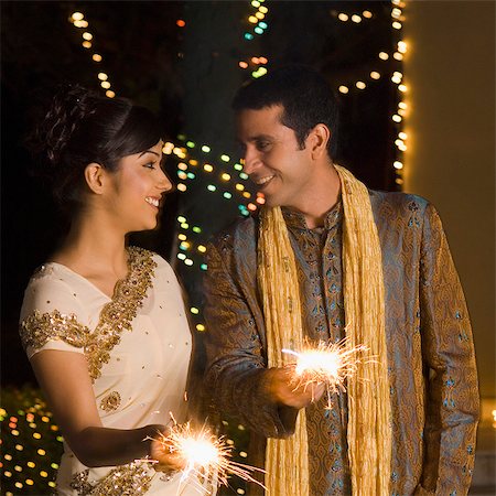 simsearch:630-03480138,k - Couple celebrating diwali Stock Photo - Premium Royalty-Free, Code: 630-03480215